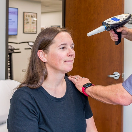 Chiropractic Centennial CO Woman Receiving Cryosculpting